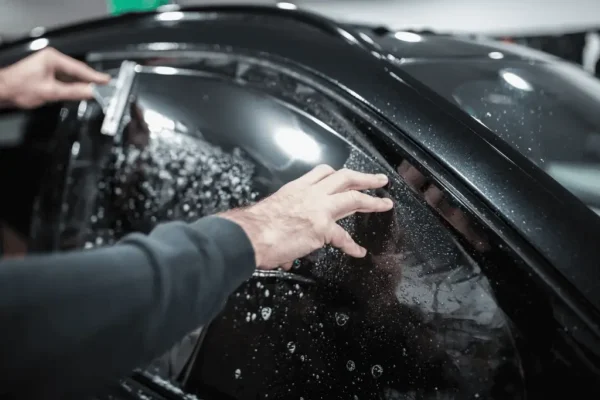 window tint being applied to a cart window