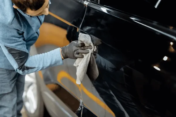 man polishing vinyl wrap